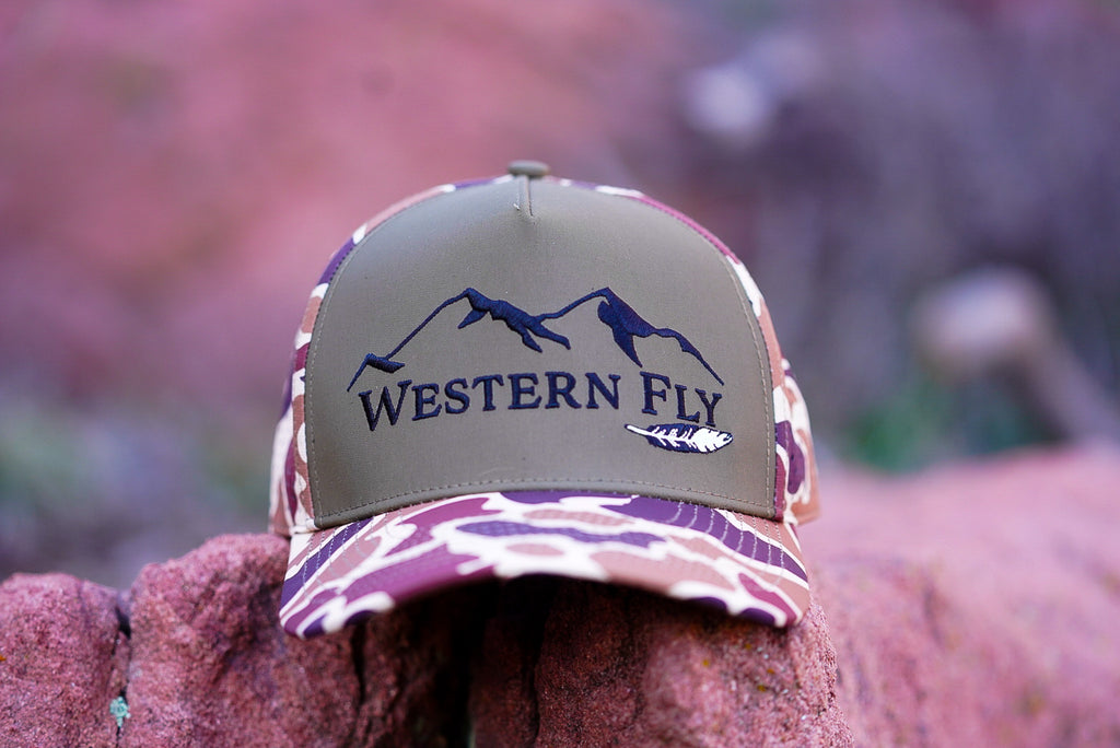 Hat with 'Western Fly' logo on a blurred natural background