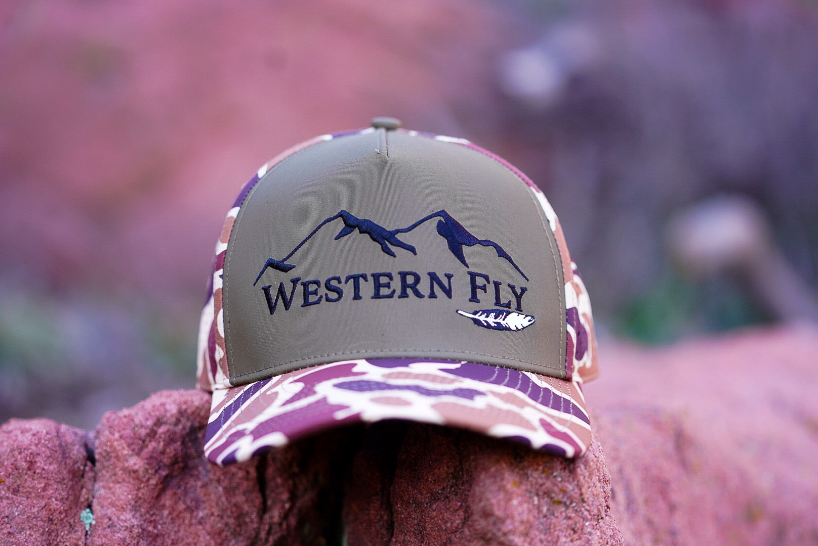 Hat with 'Western Fly' logo on a blurred natural background